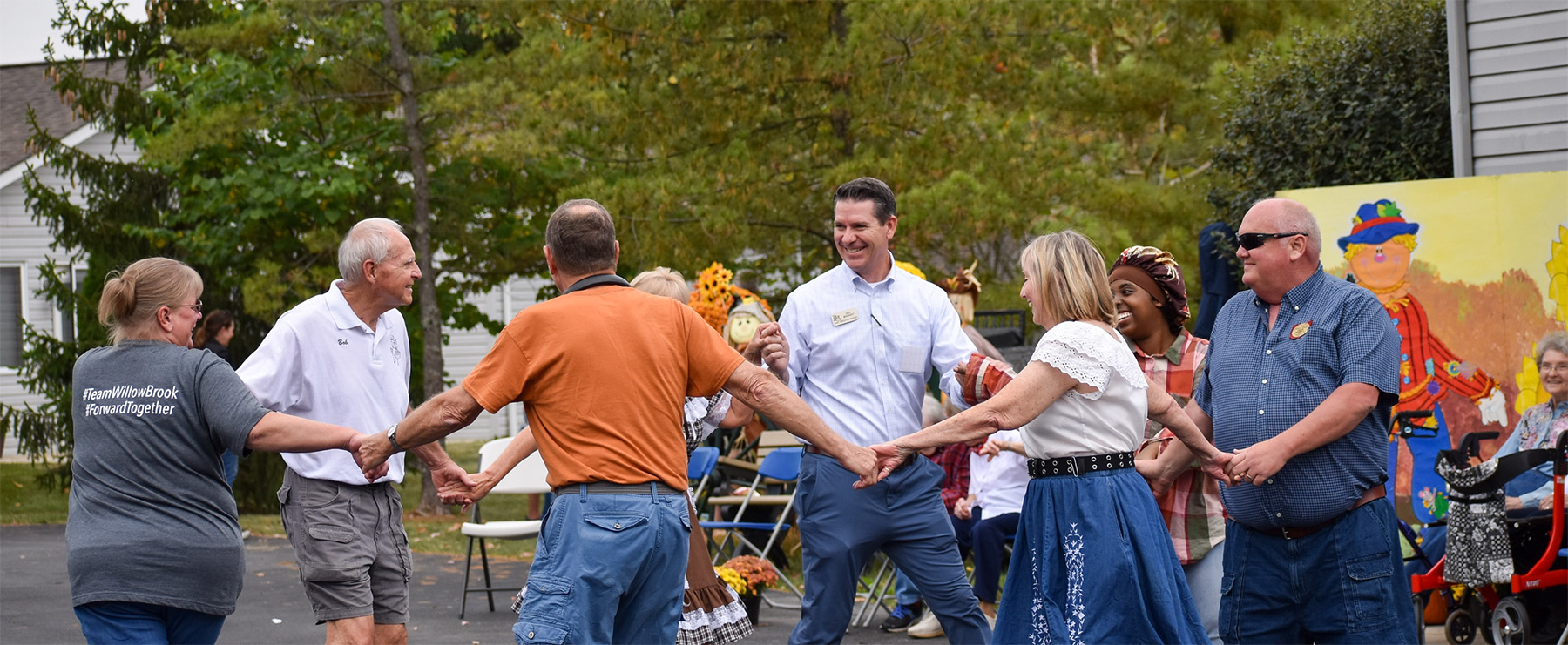 A community gathering on the Willow Brook campus in Ohio, used as a call-to-action background image.