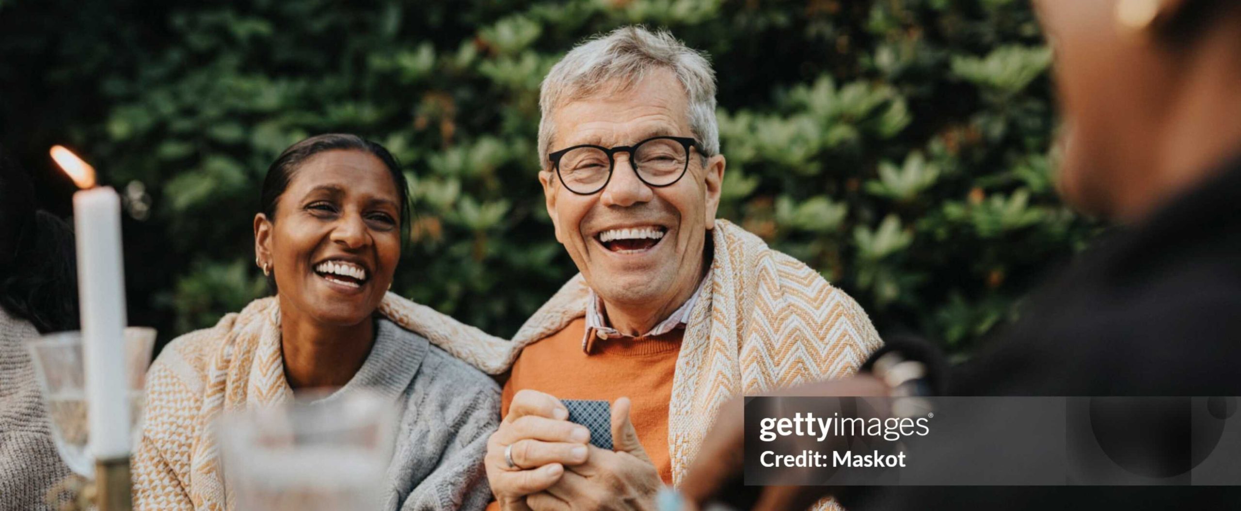 A warm dinner scene featuring an older couple, used in Willow Brook senior living marketing materials in Ohio.