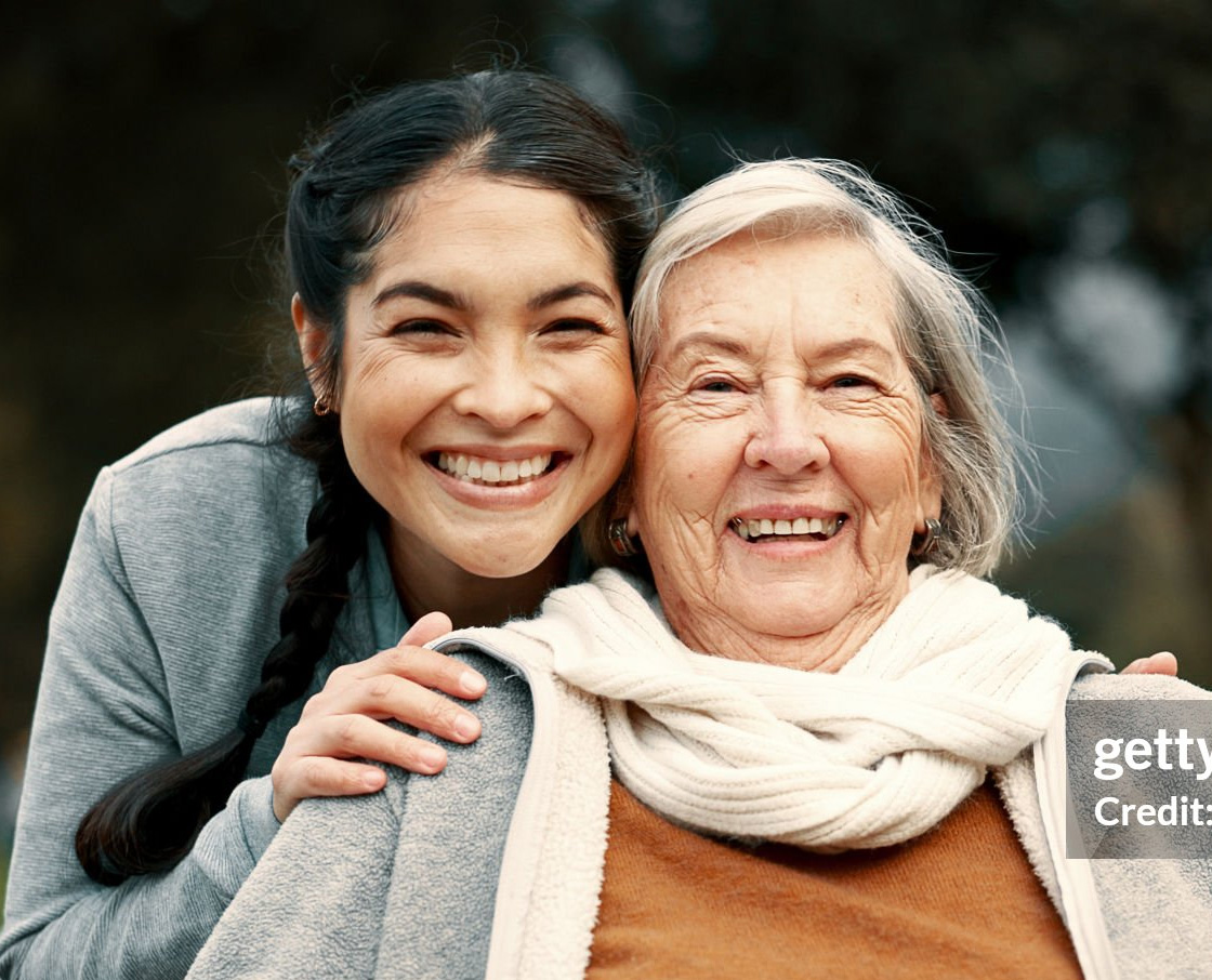 A multigenerational hug captures the family-centered spirit of Willow Brook senior living in Ohio, used as a contact page callout.