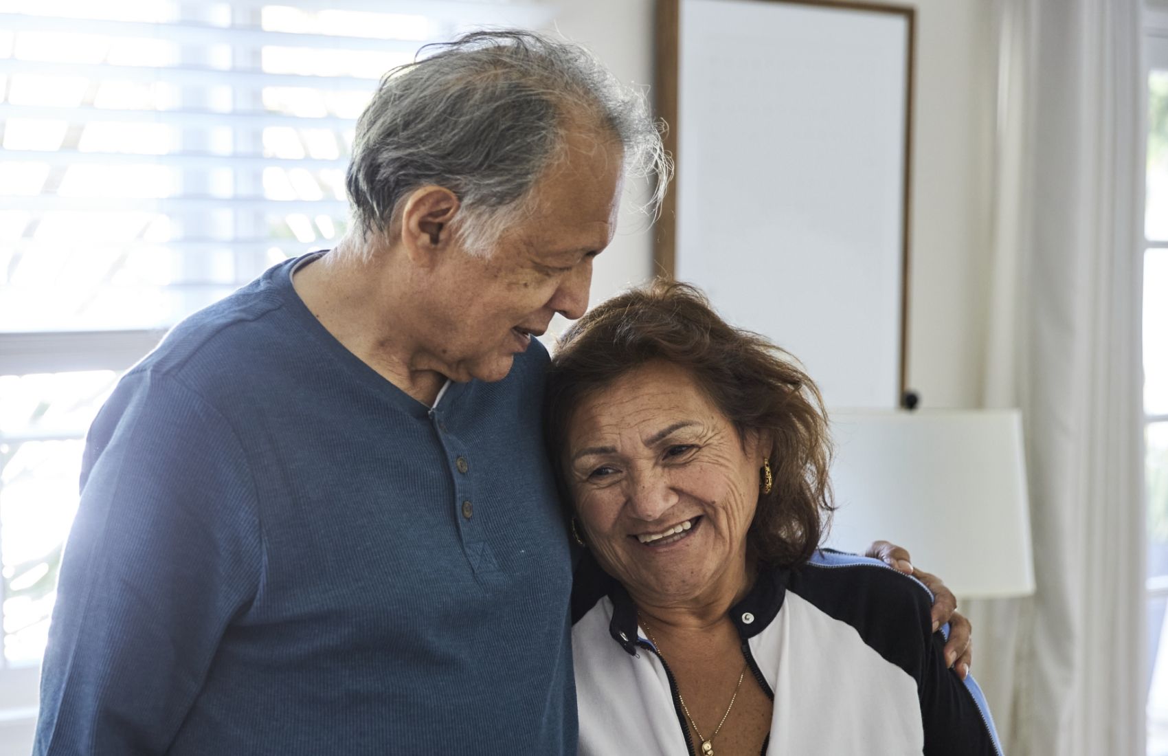 An affectionate couple at home at Willow Brook in Delaware, Ohio, used on the About page to illustrate the Foundation's role in supporting senior living.