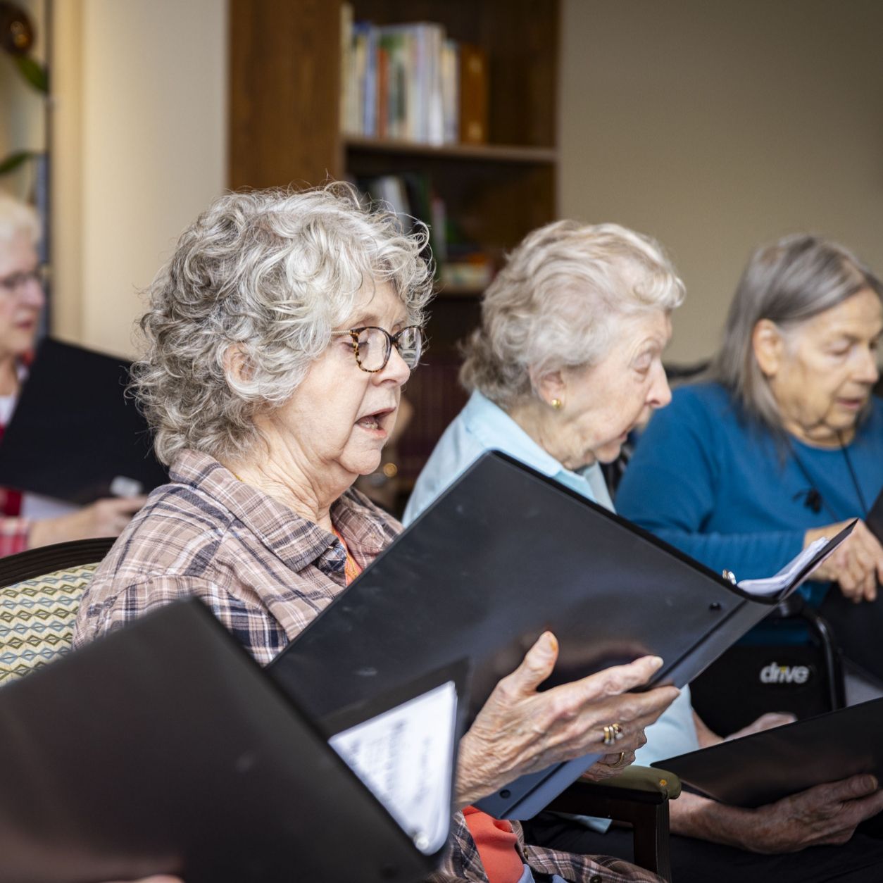 The Willow Brook Singers rehearse together in Delaware, Ohio, used as the About page header circle image for this senior living community.