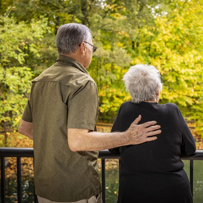 Two residents share a quiet moment together at Willow Brook in Delaware, Ohio, used as the mobile header for the Foundation giving page.
