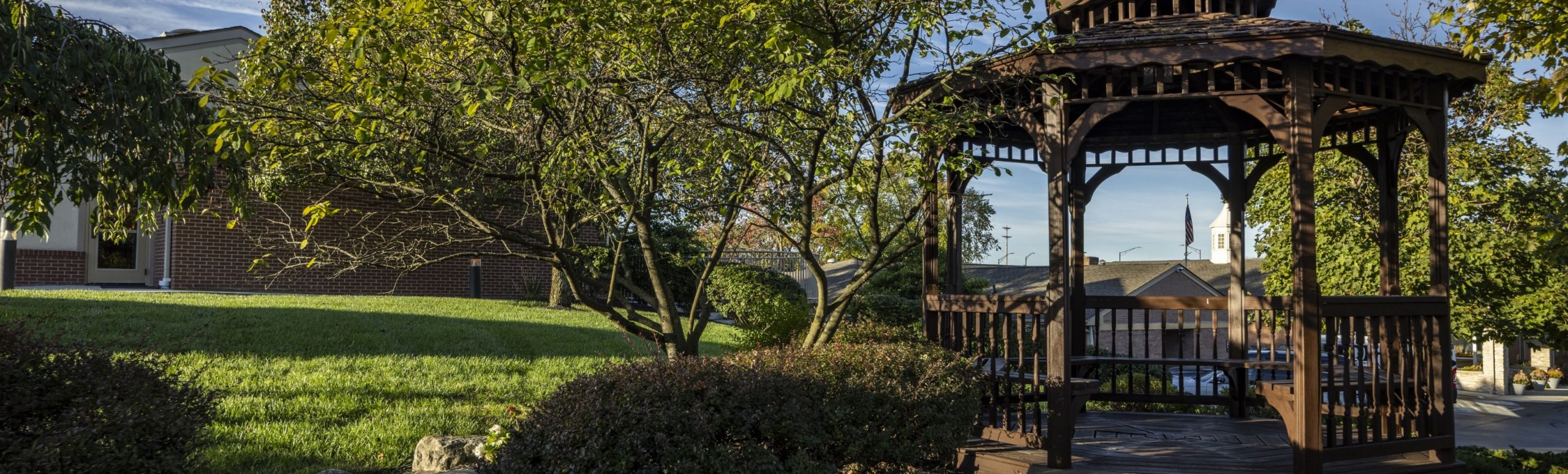 The garden gazebo on the Willow Brook Home campus in Columbus, Ohio, used as a full-width background image on the contact page.