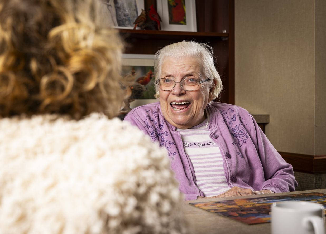 A resident shares laughter at Willow Brook Home in Columbus, Ohio, used in the general call-to-action widget for this senior living community.