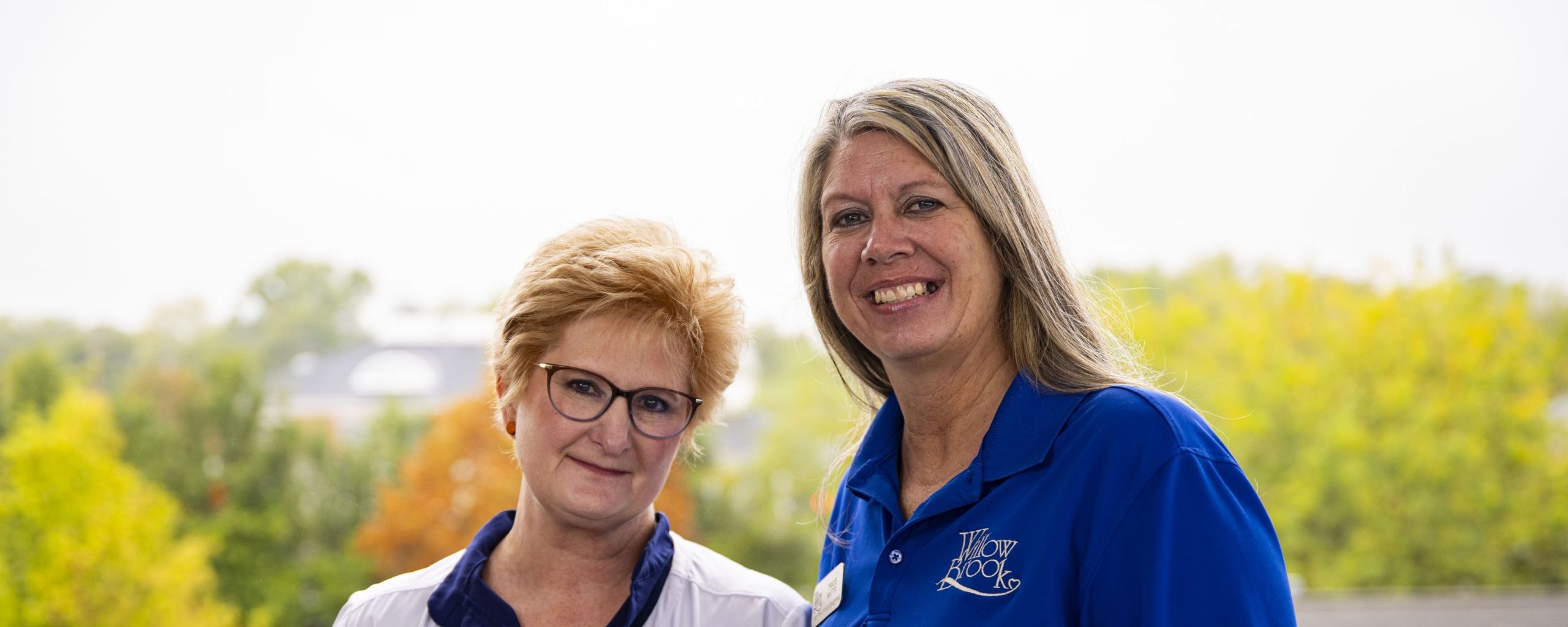 Two members of the Willow Brook leadership team in Delaware, Ohio, used as the full-width background image for the Leadership page.