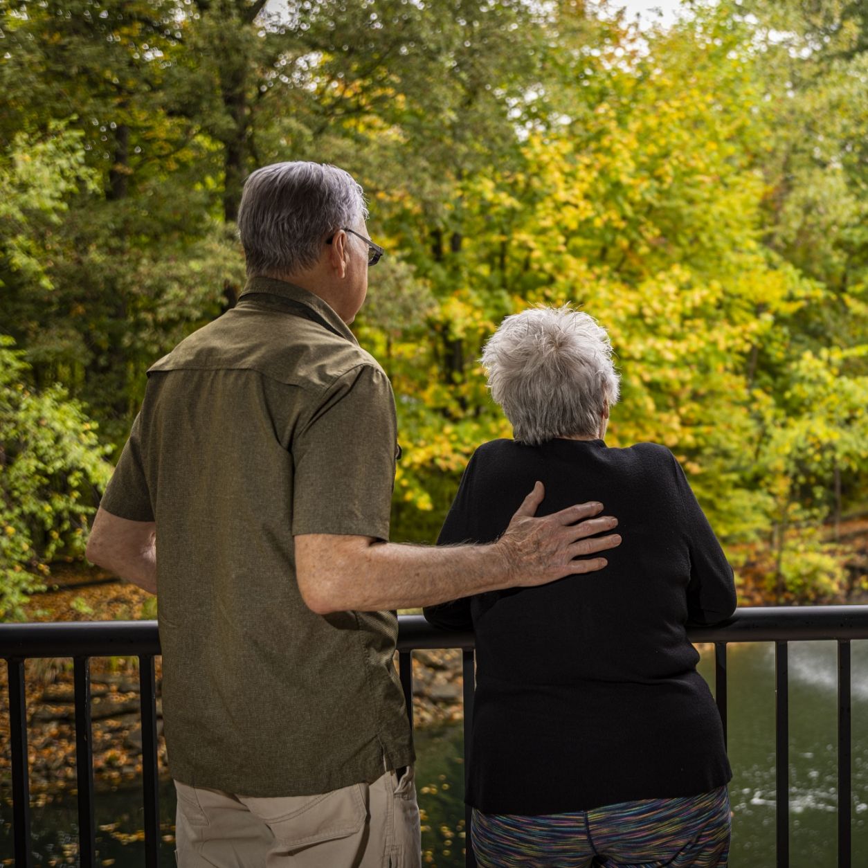 A reflective moment between two seniors at Willow Brook in Delaware, Ohio, used as the Locations page header circle image for this senior living community.