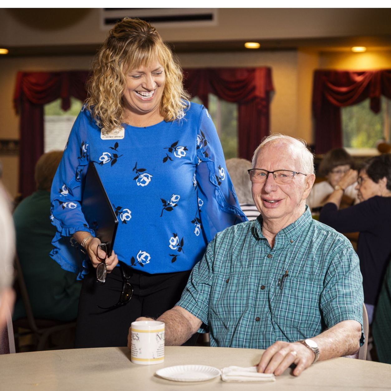 Staff and resident share a moment at a Willow Brook event in Delaware, Ohio, used as the News and Events page header circle image.