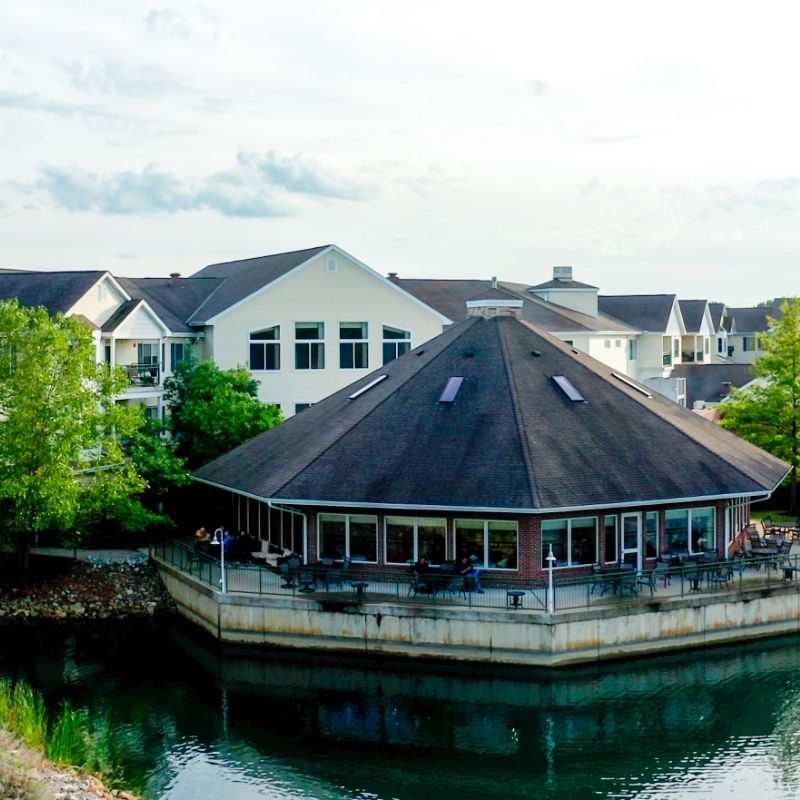 Waters Edge waterfront dining pavilion at Willow Brook Run in Delaware, Ohio, where senior residents enjoy meals overlooking the campus pond.