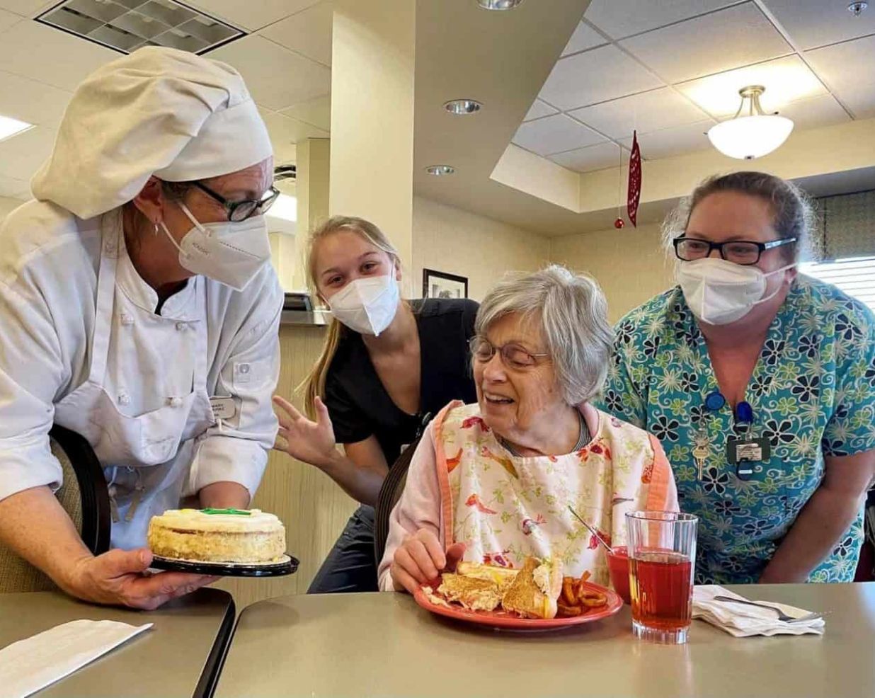 Staff celebrate a memory care resident's birthday at Willow Brook Run in Delaware, Ohio, where compassionate care extends to milestone moments.