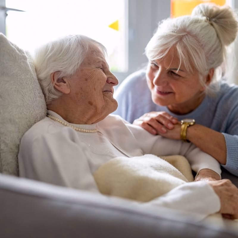 A caring moment between a caregiver and resident at Willow Brook, where compassionate long-term care supports dignity and connection in Delaware, Ohio.