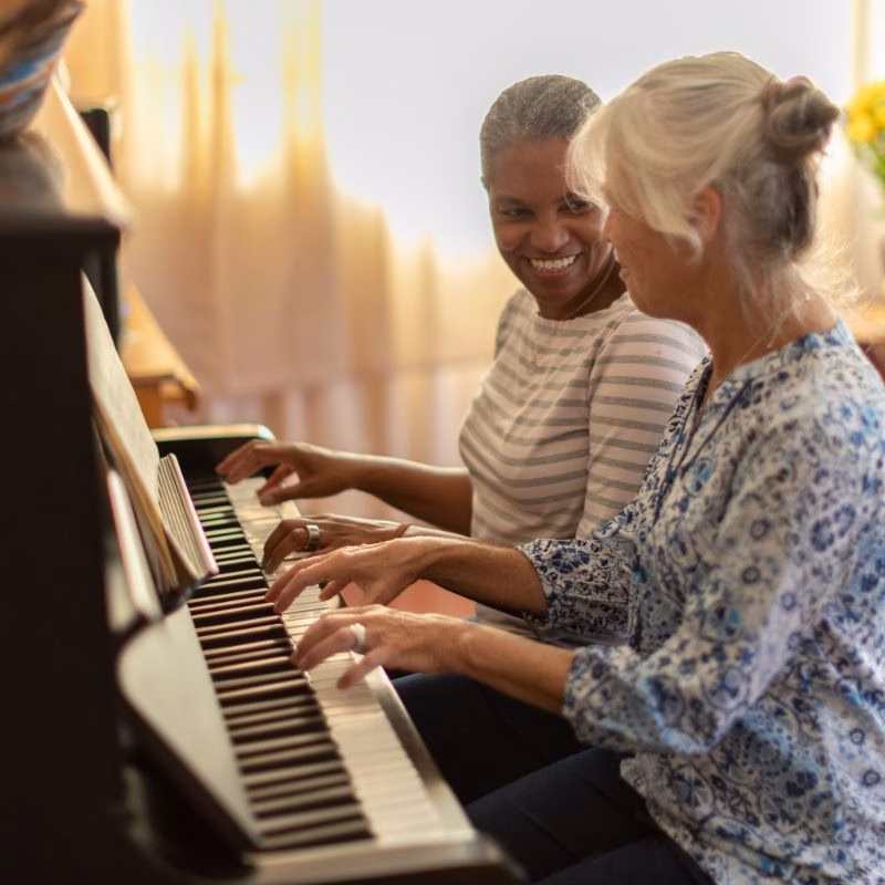 A music-filled moment in memory care at Willow Brook, where compassionate caregivers and meaningful activities support residents living with dementia in Delaware, Ohio.