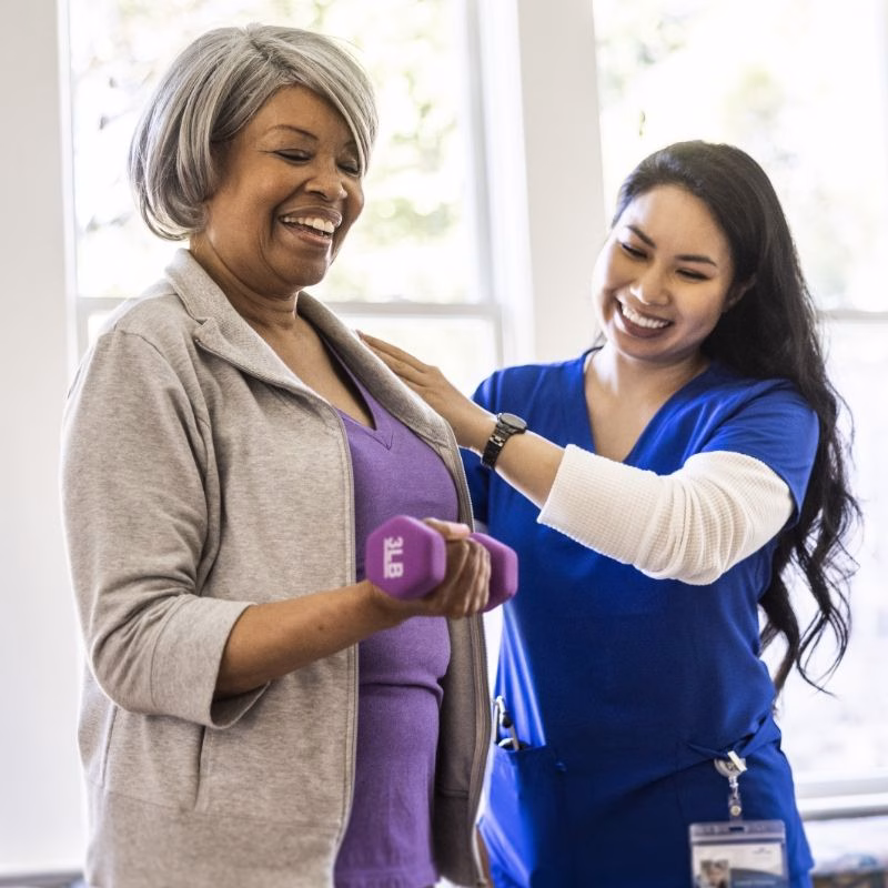 A rehabilitation session shared with a smile at Willow Brook, where therapy and nursing staff help seniors recover after illness or injury in Delaware, Ohio.