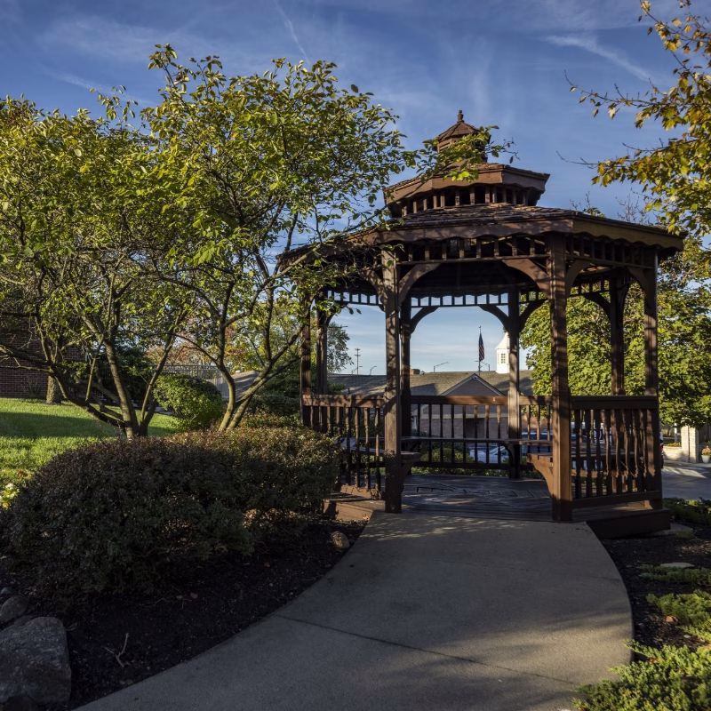The garden gazebo at Willow Brook Home in Columbus, Ohio, offers a peaceful outdoor retreat for residents exploring the senior living community's campus.