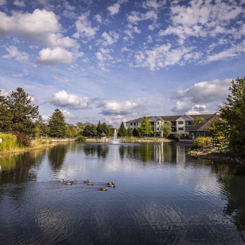 A scenic pond with a fountain and ducks anchors the Willow Brook Run campus in Delaware, Ohio, where independent living residents enjoy waterfront views and an active senior lifestyle.
