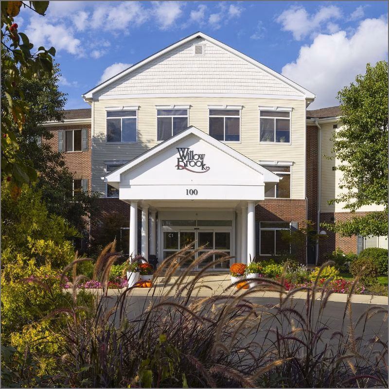 Front view of Willow Brook Run in Delaware, Ohio, used as the mobile landing-page header for this senior living community offering independent, transitional, assisted, and memory care.