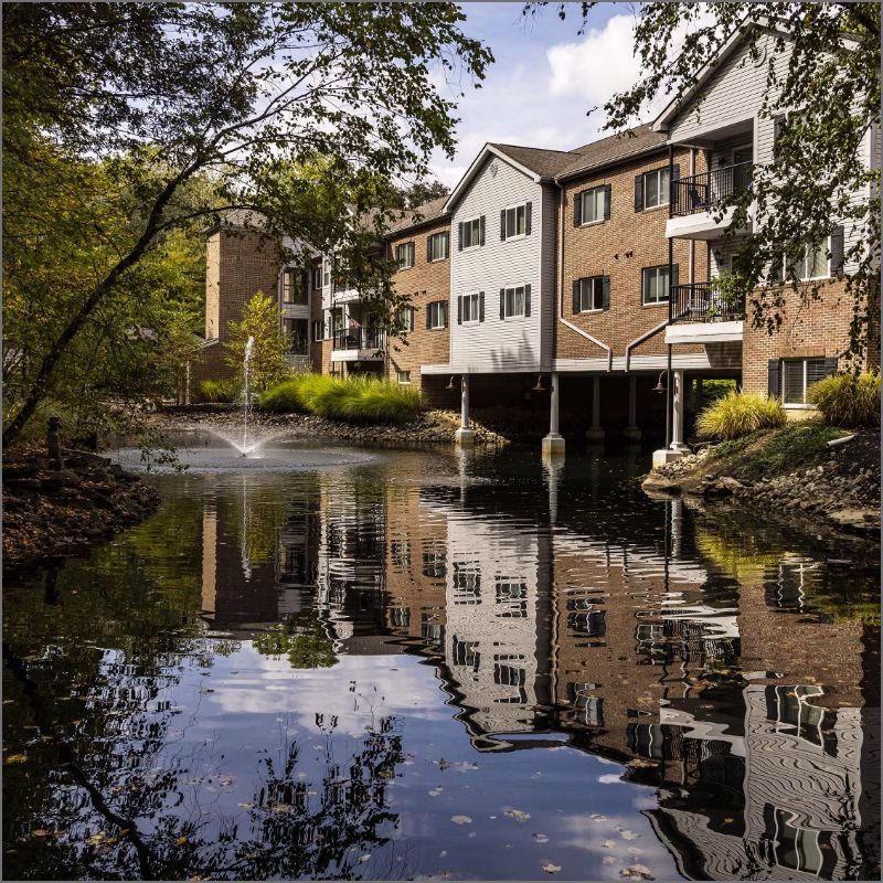 The signature pond view of Willow Brook Village in Delaware, Ohio, used as the mobile landing-page header for this charming senior living community.