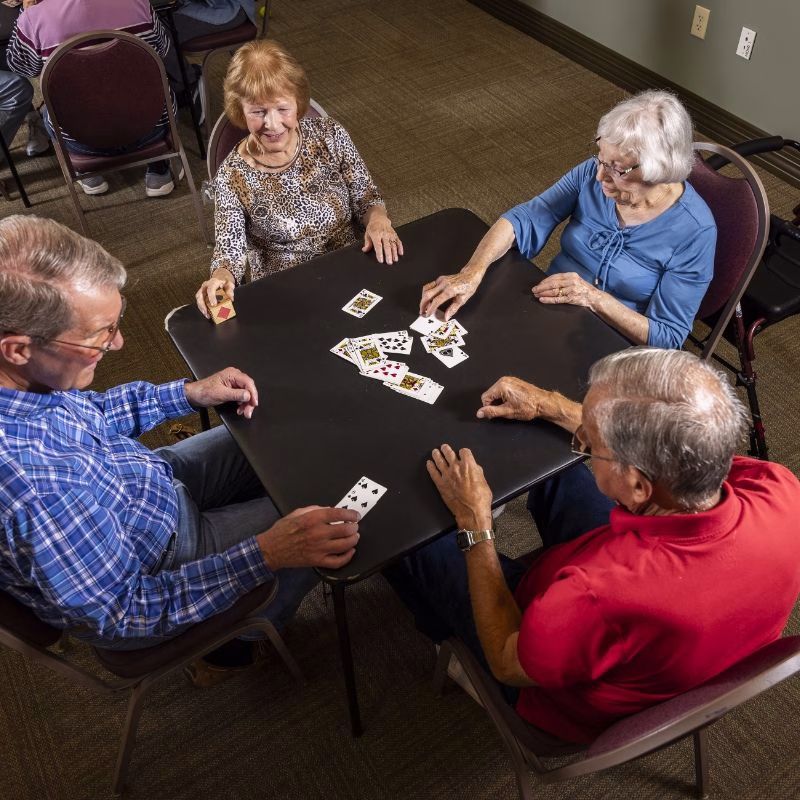 Residents enjoy a card game at Willow Brook Village in Delaware, Ohio, where life enrichment programming keeps the senior living calendar full of social activities.
